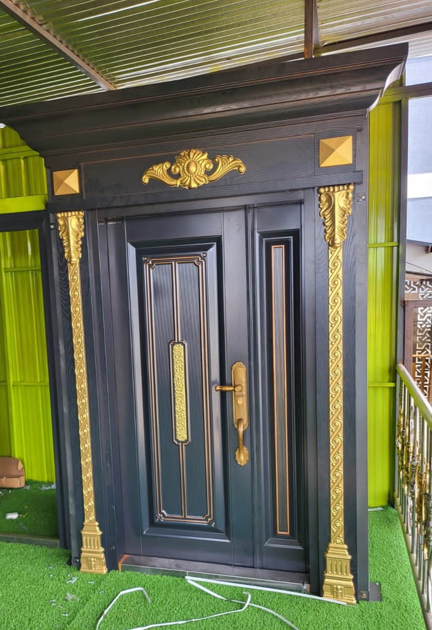 Executive steel door with laser-cut geometric lattice window insert and brass hinges