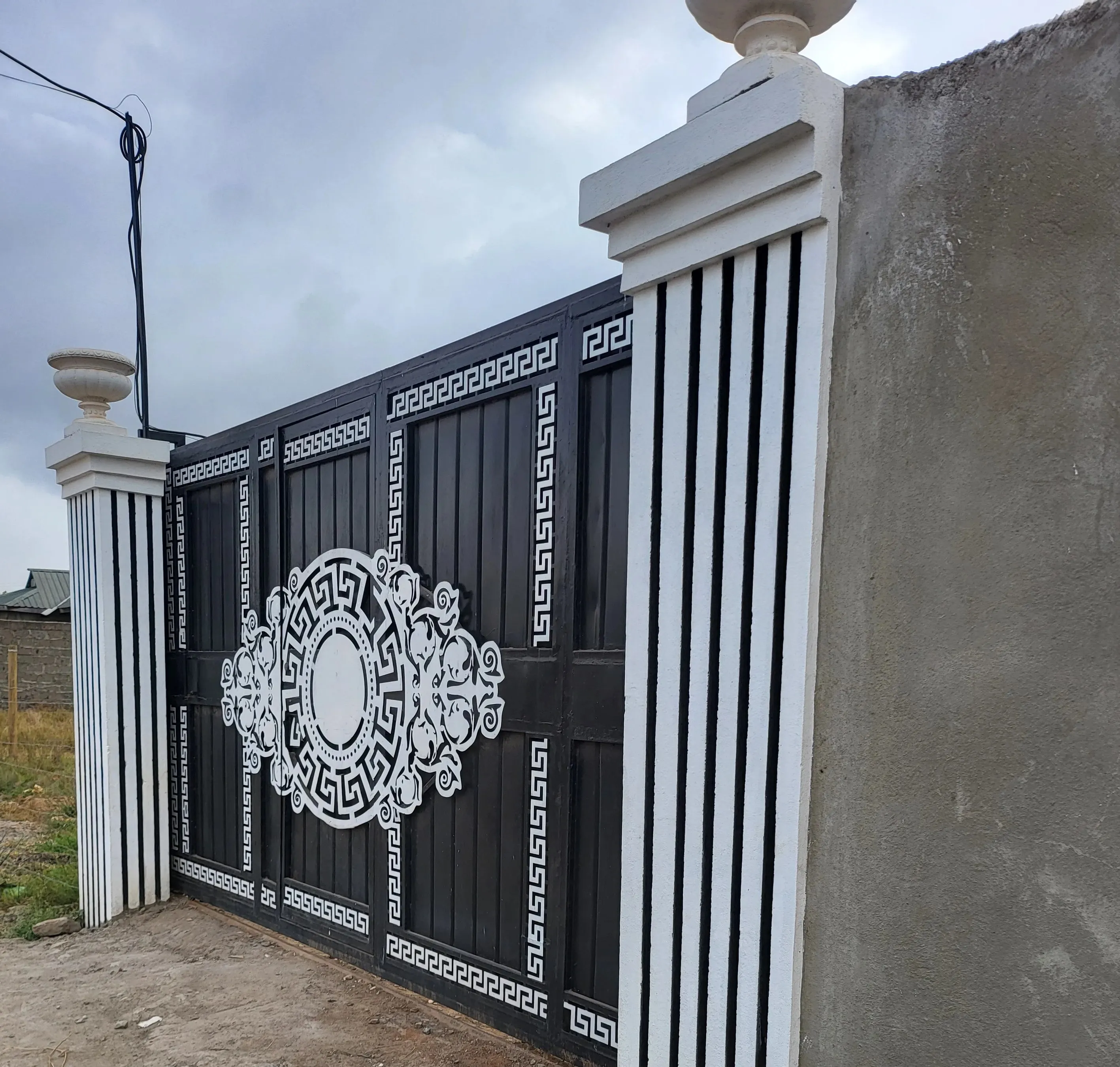 Custom fabricated steel swing gate for a residential entrance